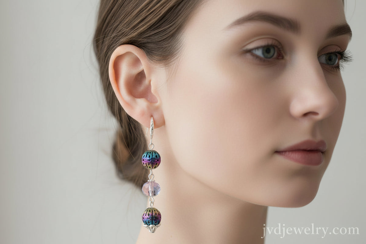 Multicolored beaded earrings on a brown card with a dark background