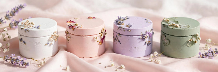 Handmade resincrete trinket jars in pastel colors with dried flowers
