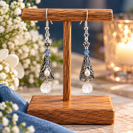 Vintage freshwater pearl earrings with lentils on wooden display stand