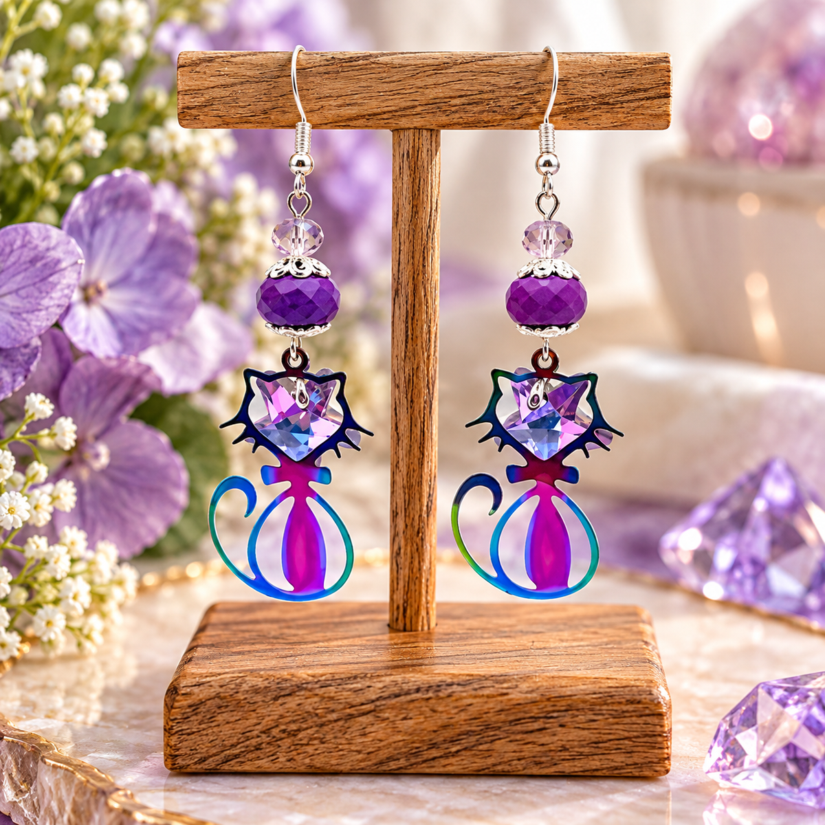 Purple ion plating cat earrings with crystal star on wooden display stand