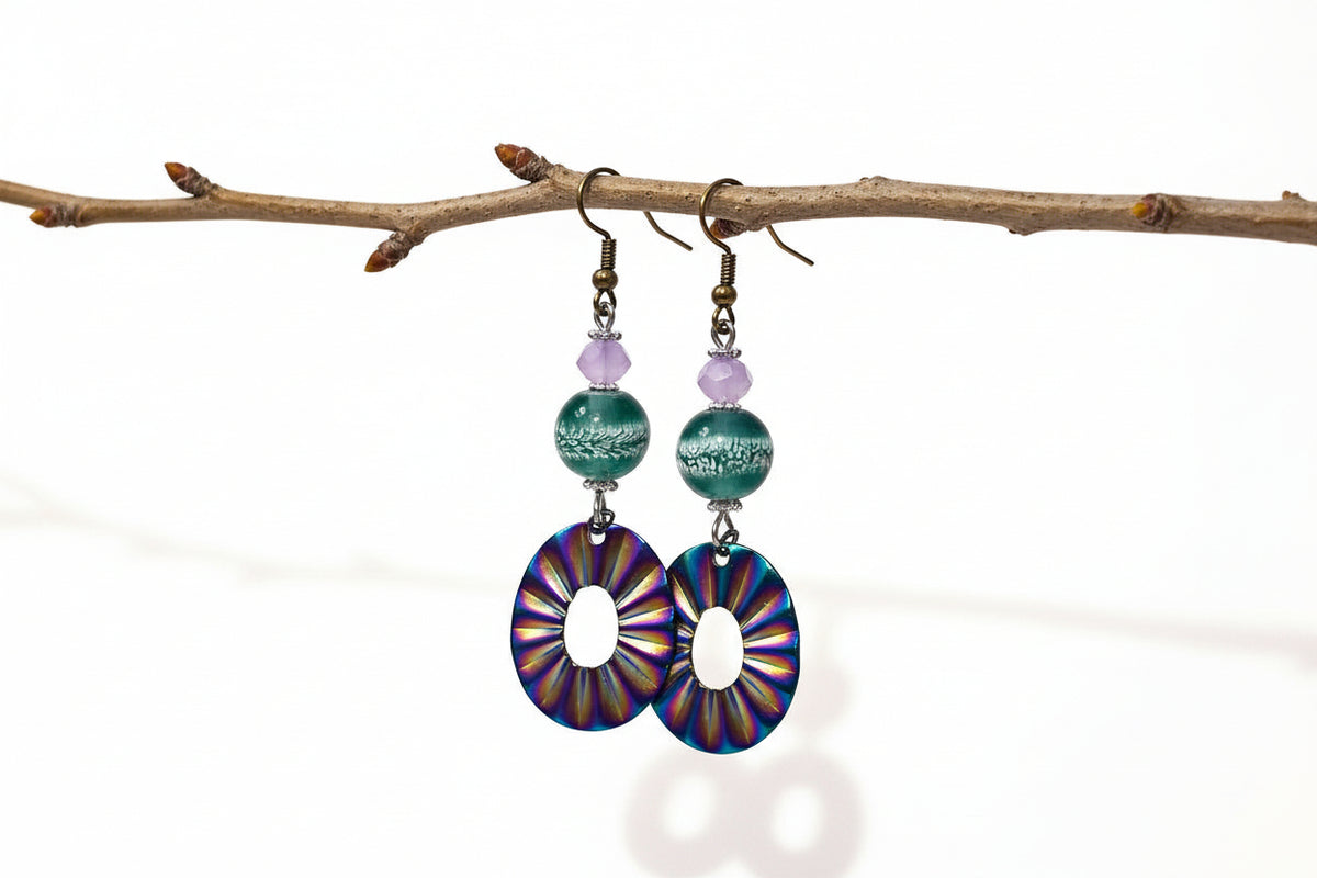 Colorful circular earrings with beaded accents on a white background