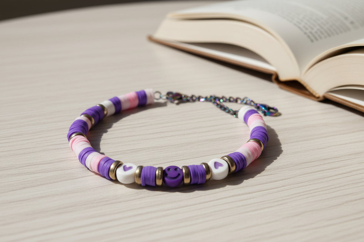 Colorful beaded bracelet with a chain on a light background
