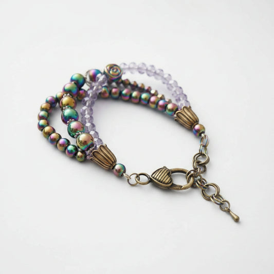 Multicolored beaded bracelet with a clasp on a white background