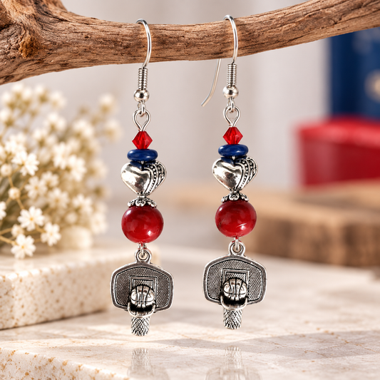 Silver basketball dangle earrings with red glass beads, blue spacers and heart beads styled with baby's breath flowers