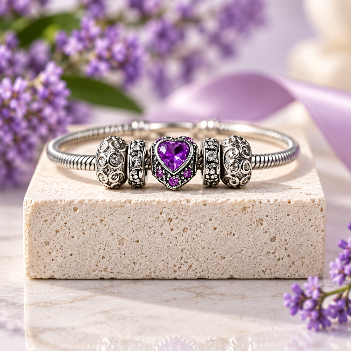 Purple heart charm bracelet with silver-plated snake chain and crystal charms, front view