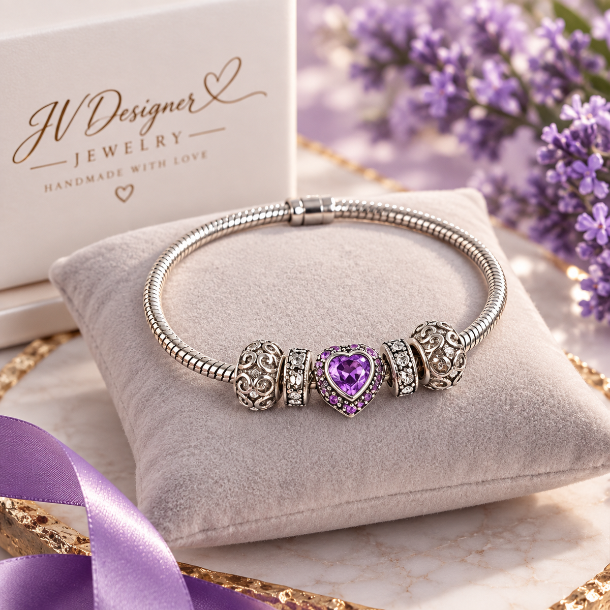Purple heart charm bracelet with silver-plated snake chain and crystal charms, detail view
