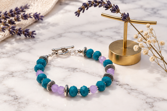 Close-up of silver toggle clasp on handmade teal bead bracelet