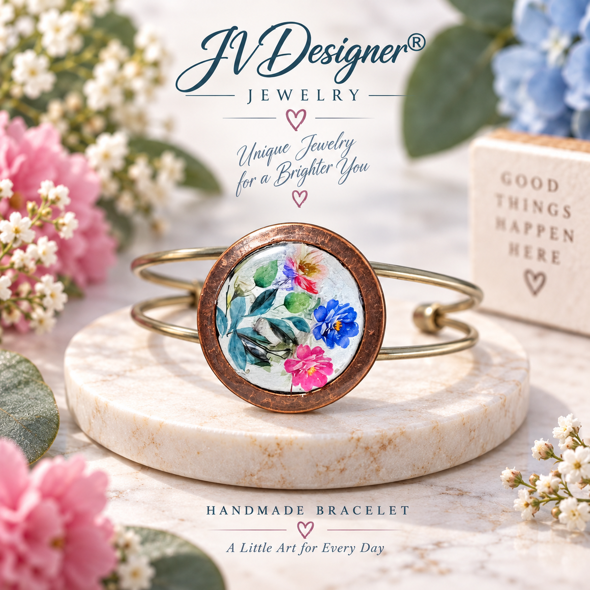“Handmade copper cuff bracelet with watercolor floral design in blue, pink and green.”