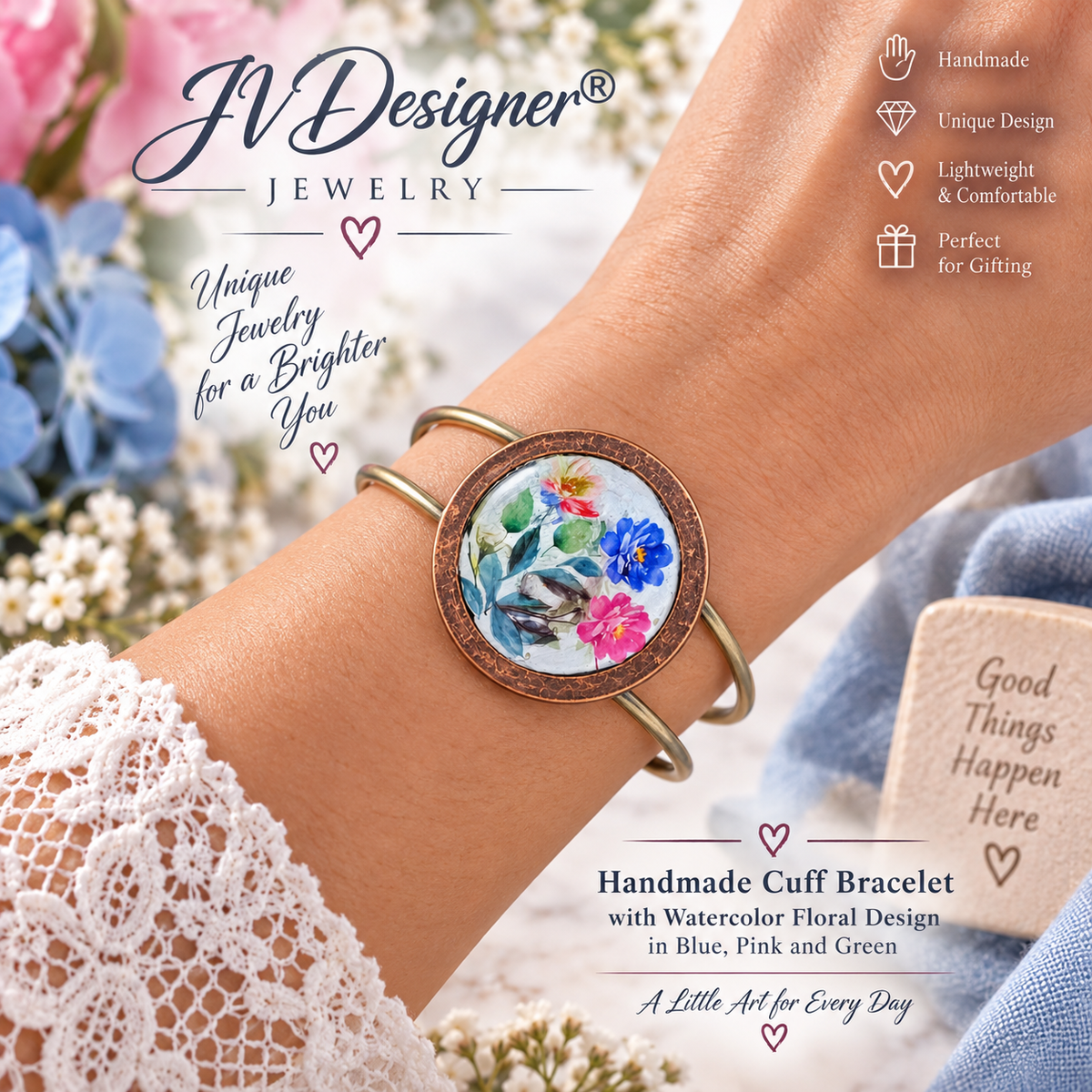 A handmade cuff bracelet with a round floral cabochon and gold-toned metal bands, worn on a person's wrist. The background is a soft-focus floral setting with text overlays from 'JVDesigner Jewelry' highlighting the product's handmade, lightweight, and comfortable qualities.