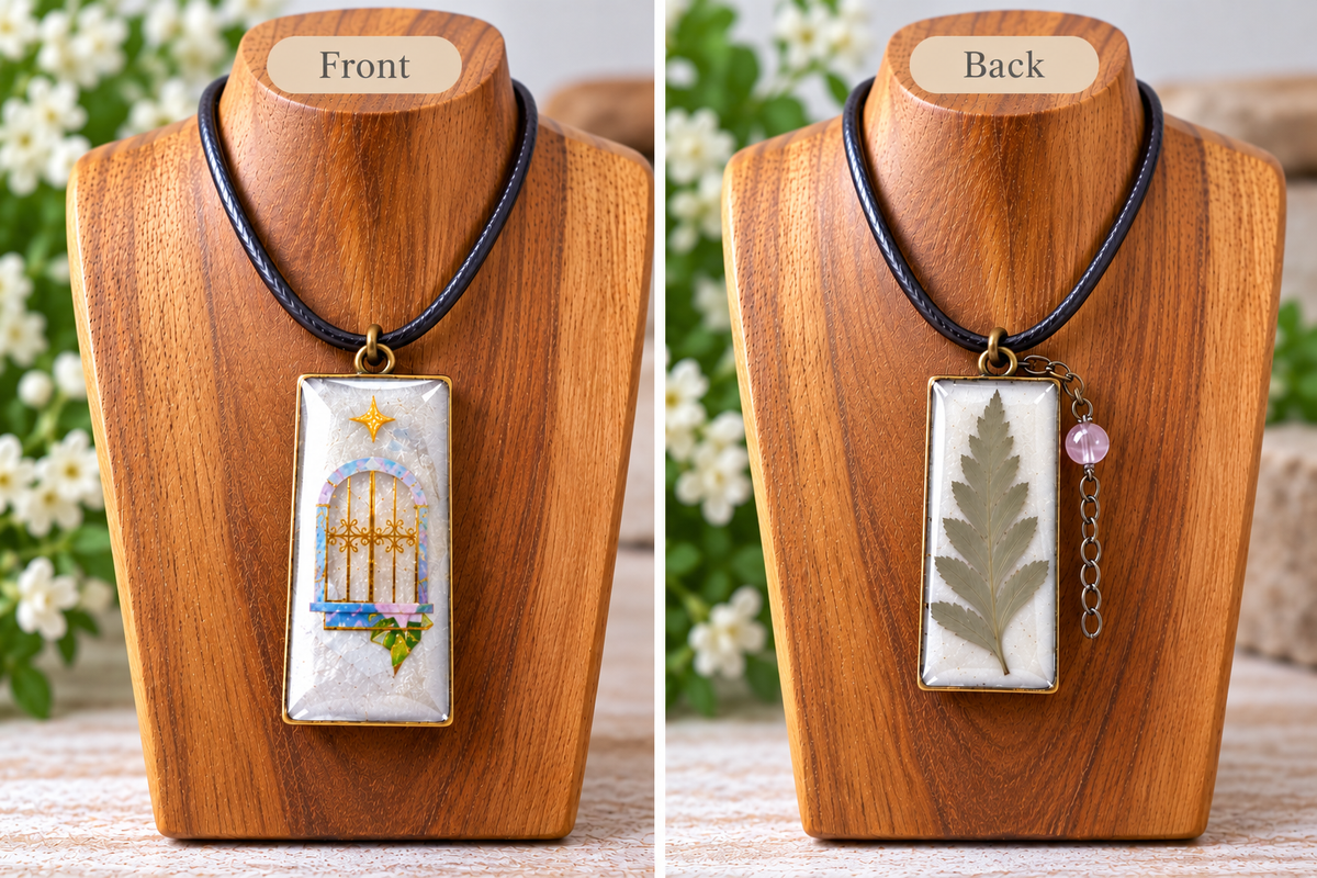 A two-panel product display showing the front and back of a rectangular pendant necklace on wooden mannequin busts. The left panel labeled Front shows a white pendant with a gold-toned birdcage illustration and small green/blue accents.