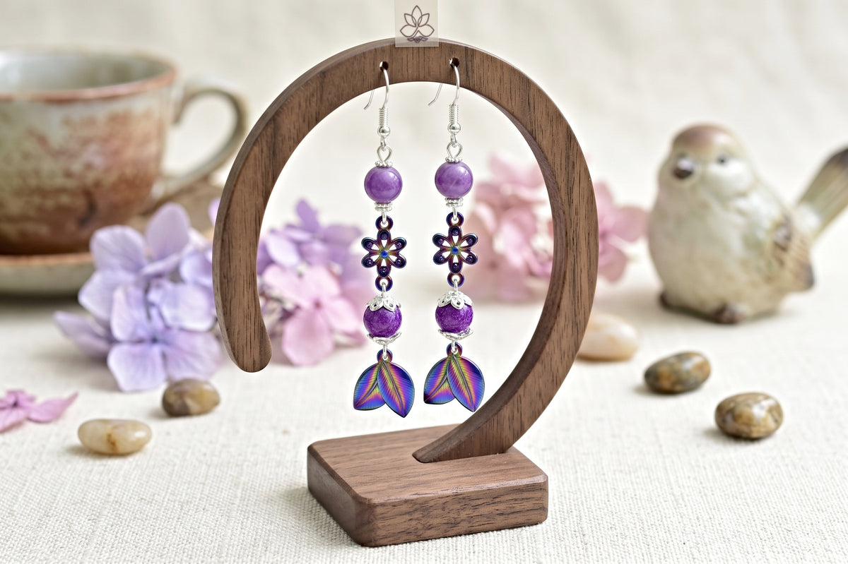 Rainbow Leaf Earrings - Stainless Steel Dangle Earrings with Glass Beads on a wood stand