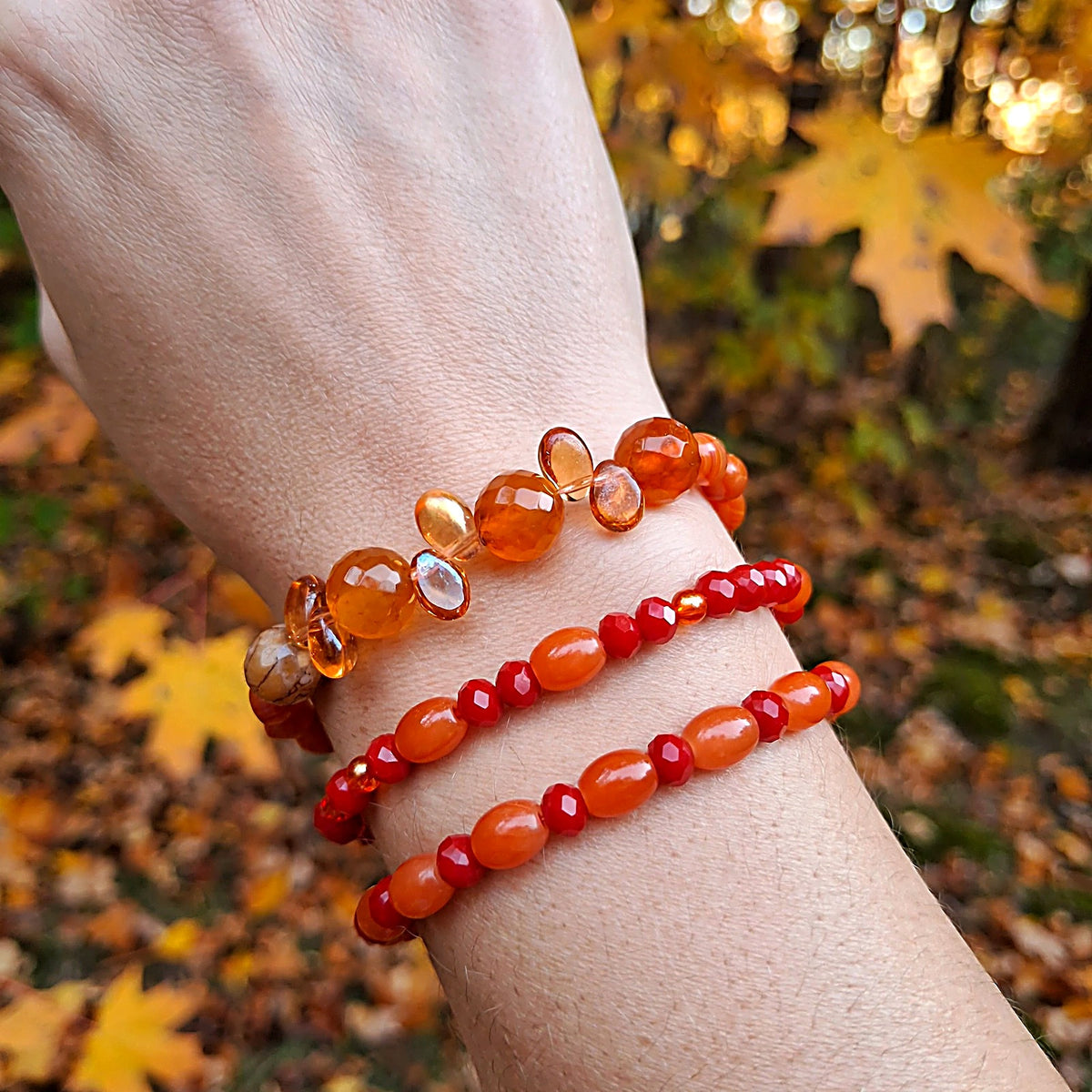 Autumn glass bead bracelet set of 3 worn stacked on a wrist