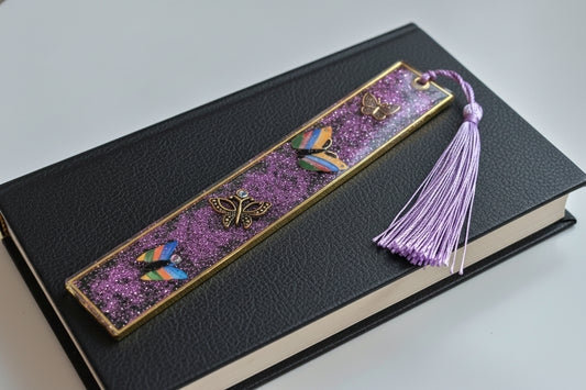 Decorative bookmark with butterflies and a tassel on a white background